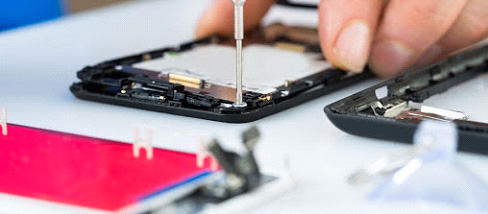 Expert technicians repairing a water damage IPhone